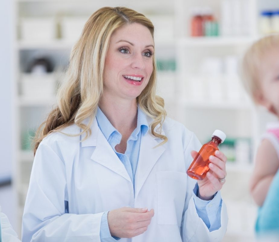 Pharmacist Handing Over Medication